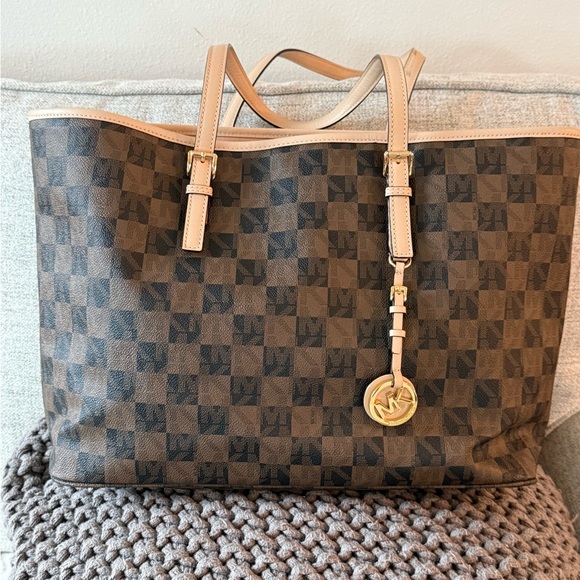 Michael Kors Handbags - MICHAEL Michael Kors Jet Set travel tote in a brown checkered monogram pattern.